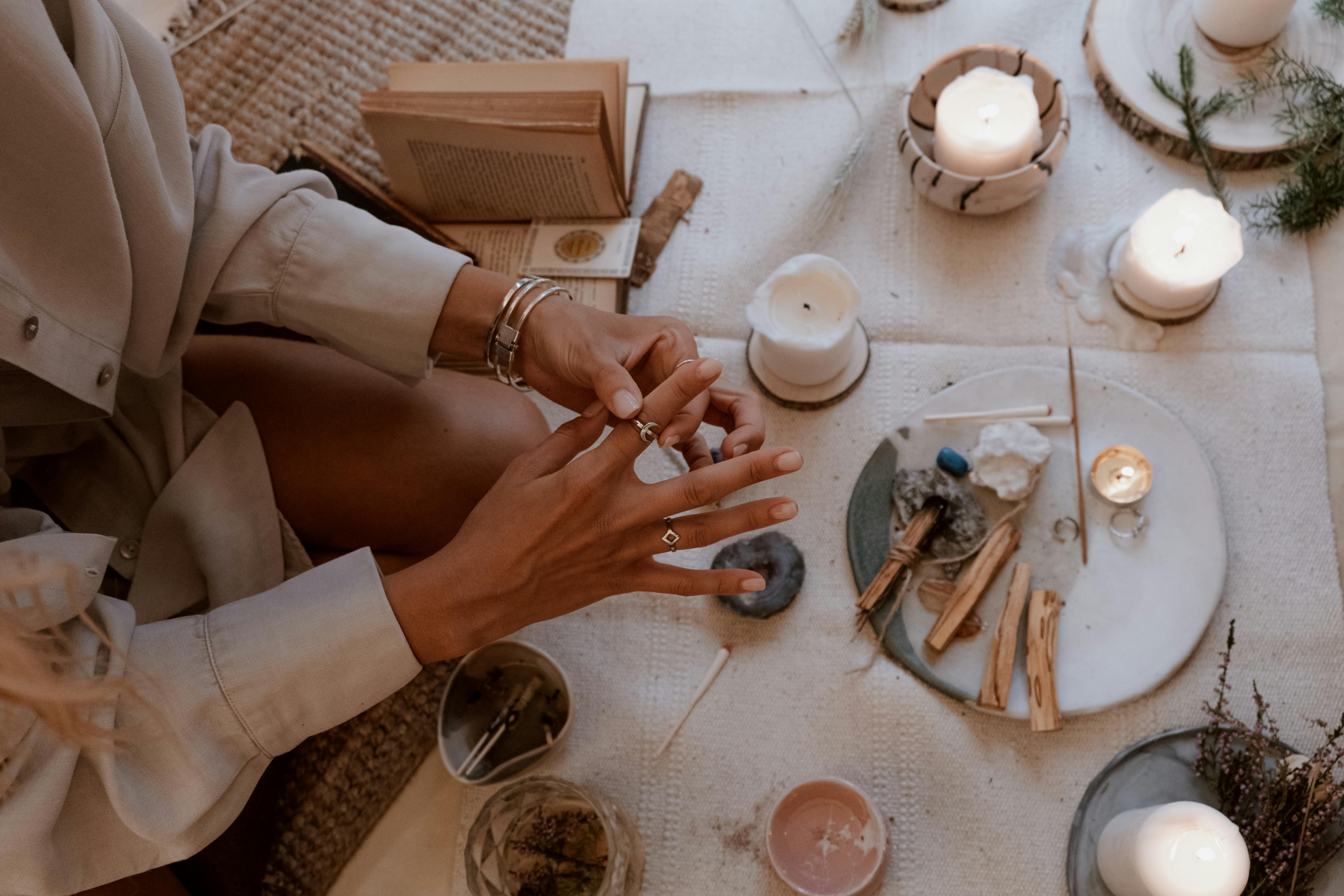 overhead shot of a person s hands putting on a ring