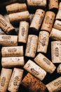 Top view of wine timber corks with logo and caption on black background