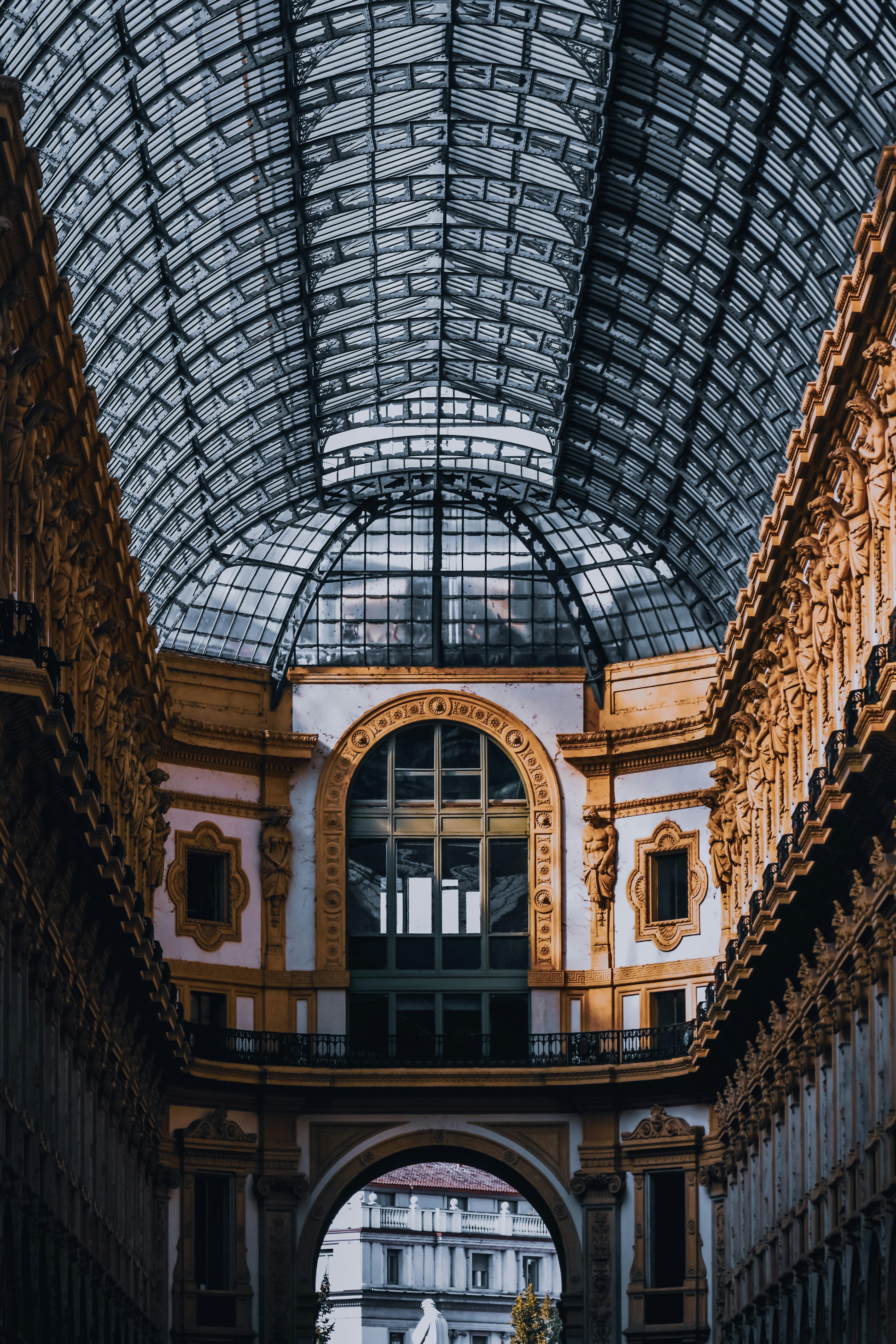 interior of aged passage with ornamental walls and domed glass roof