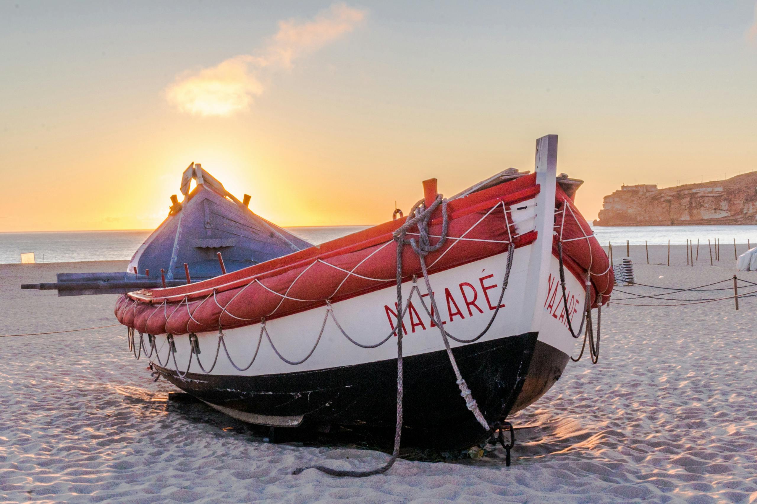 Red White and Black Boat on Sand · Free Stock Photo