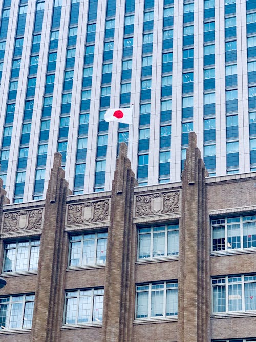 Photo of the Flag of Japan on Top of a Building