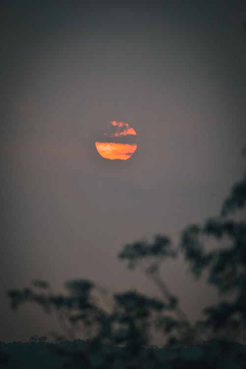 Free Photograph of Clouds Covering the Sun During Sunset Stock Photo