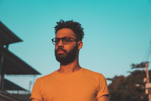 Free Bearded man wearing glasses in Rio de Janeiro with striking sunlight. Stock Photo