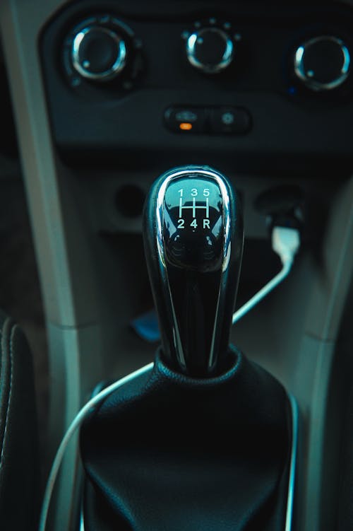 Photograph of a Black Stick Shift of a Car