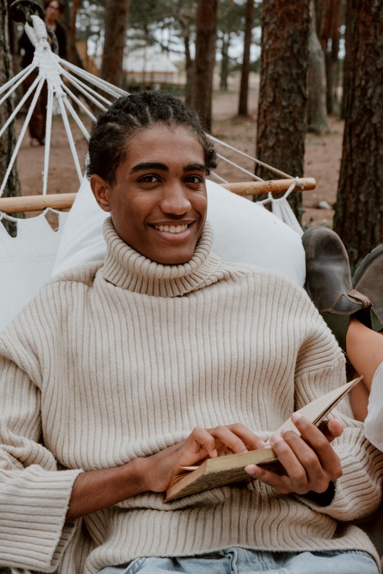 Portrait Of A Man In A Beige Sweater Smiling