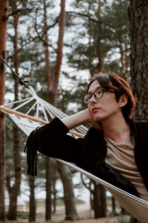 A Man Lying Down on a Hammock