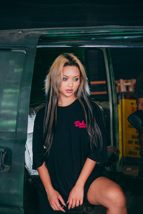 Photograph of a Woman Wearing a Black and Pink Shirt