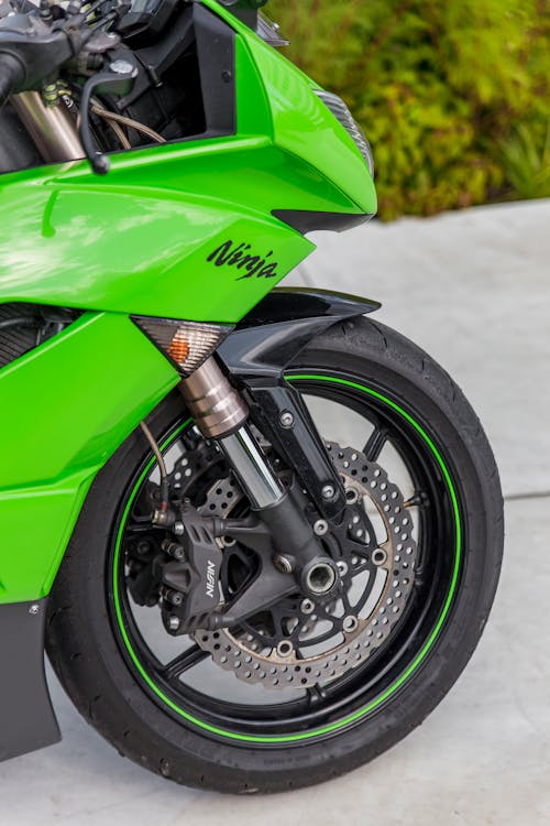 Close-Up Shot of Green and Black Motorcycle