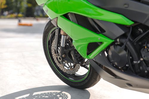 Close-Up Shot of a Green Motorcycle