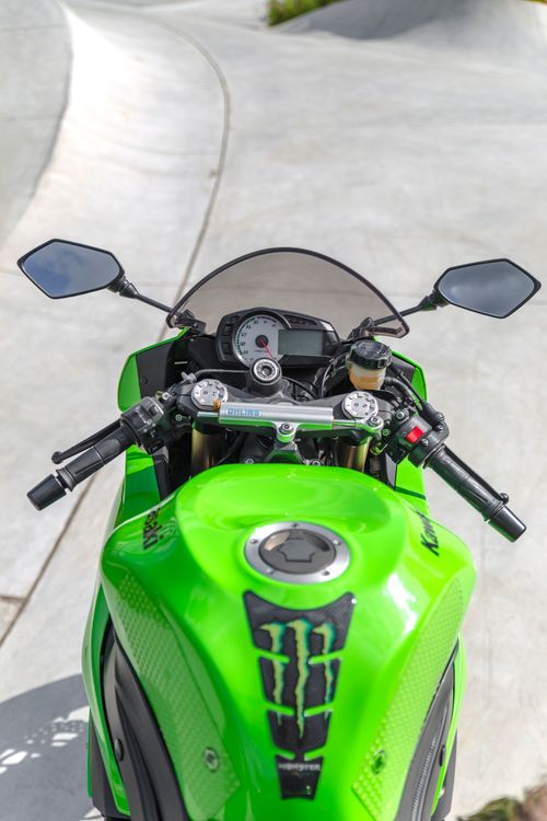Free Close-up view of a green Kawasaki motorcycle highlighting its powerful design and features. Stock Photo