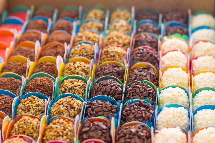 Close-up of chocolate brigadeiros with colorful toppings