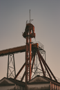 Red and Black Tower Under Gray Sky