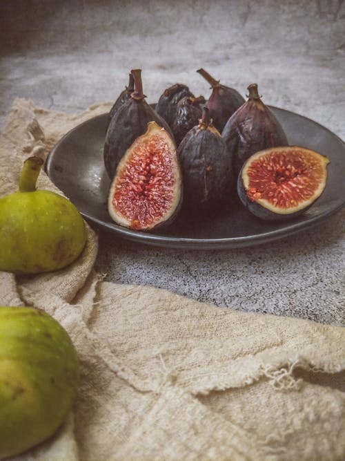 Free Fig Fruits Served on  na Ceramic Plate Stock Photo