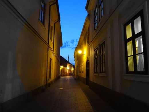 Lamplit alley at dusk in the old town — photo by SevenStorm JUHASZIMRUS on Pexels