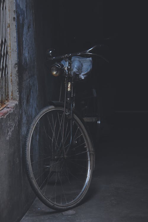 Free A Bicycle Leaning on the Wall Stock Photo