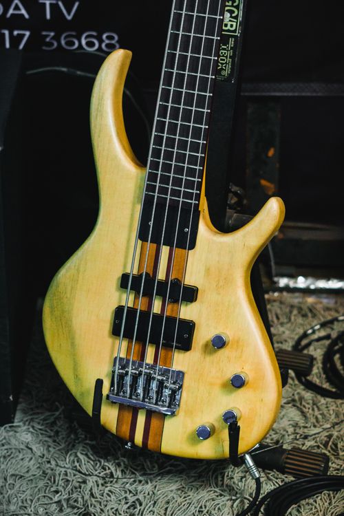 Free Detailed view of a modern electric bass guitar with intricate design elements. Stock Photo