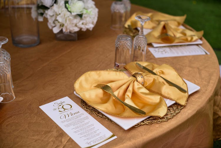 Close-Up Shot Of A Gold Ribbon Napkin