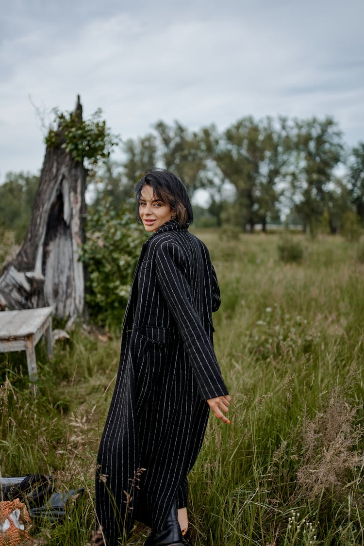 Stylish Smiling Woman In Countryside Field In Summer