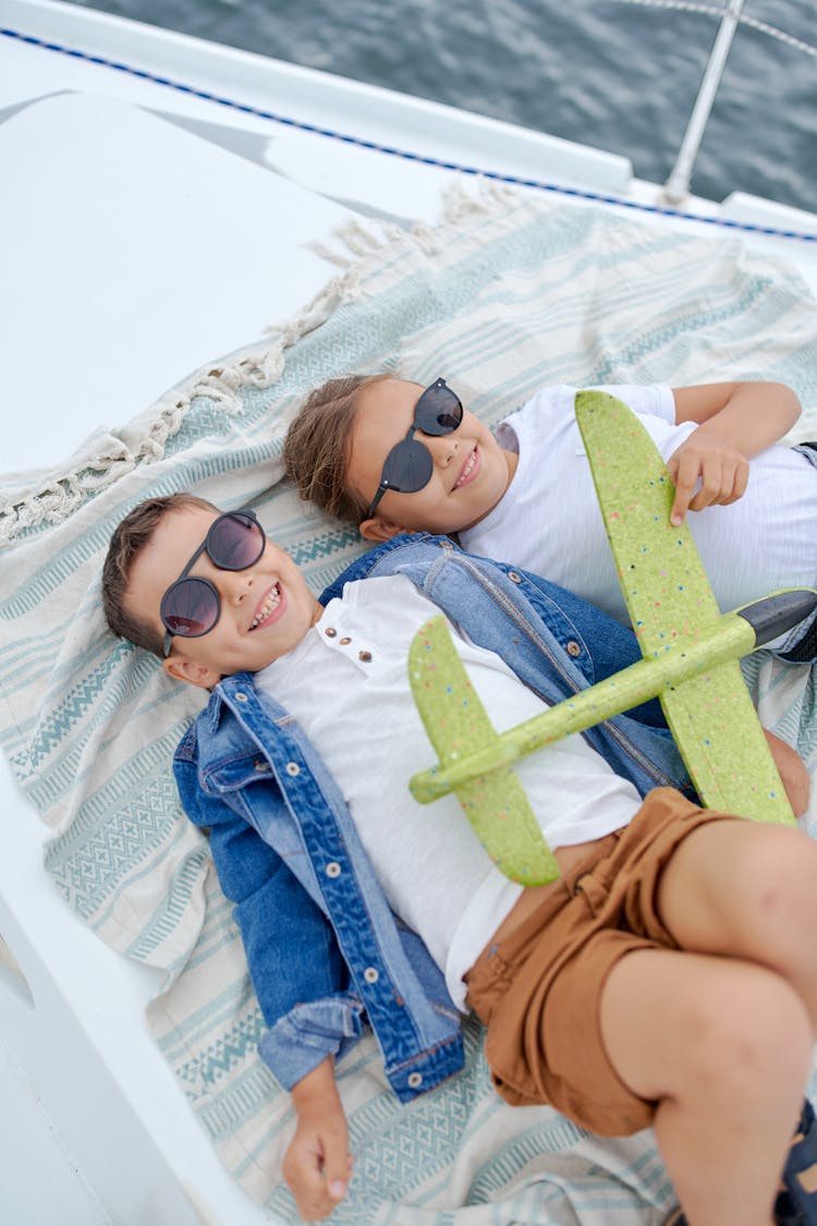 Happy Siblings On Yacht Deck