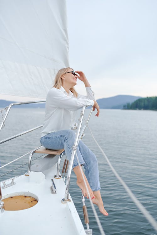 Free Young stylish woman resting on sailboat Stock Photo