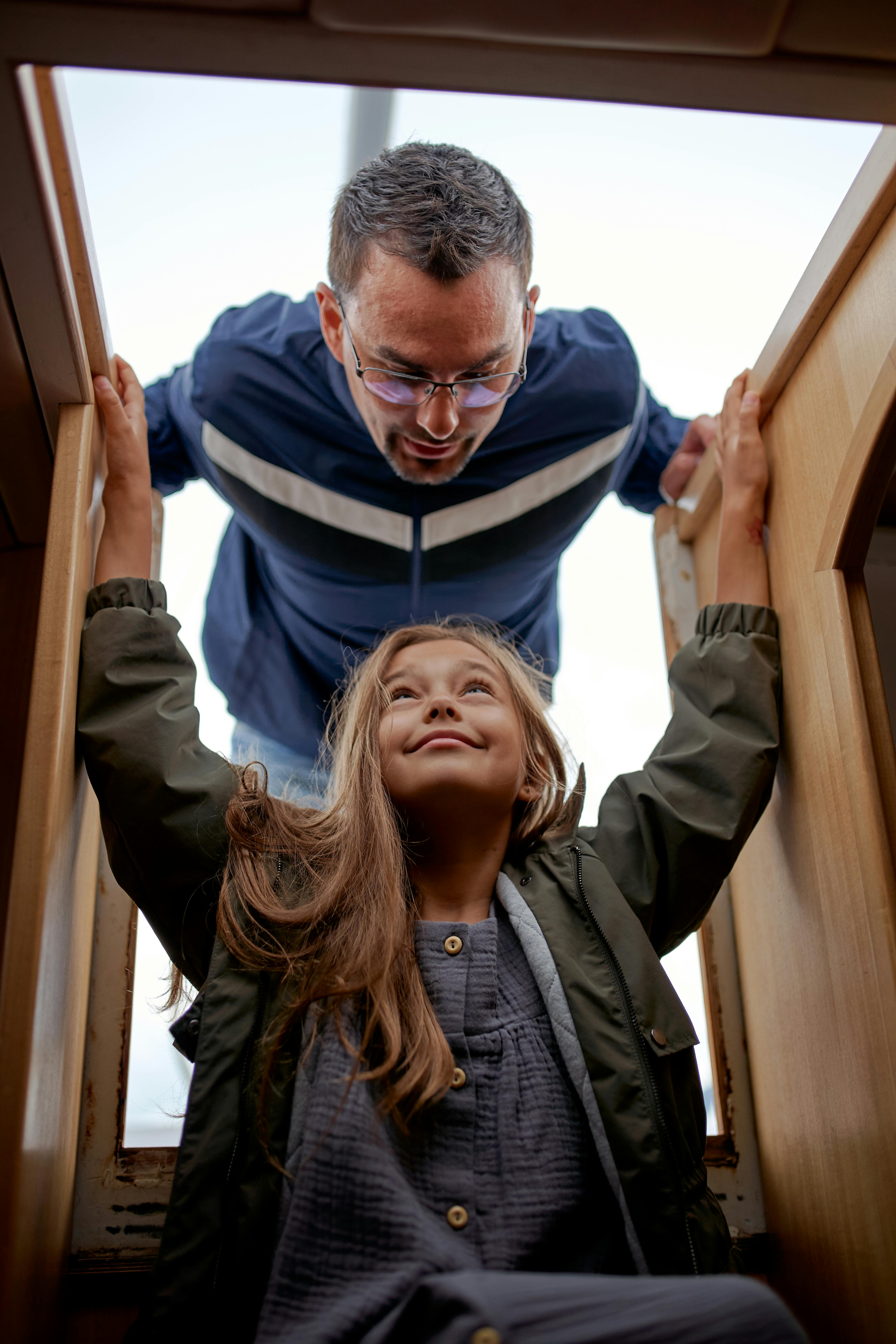 content couple on yacht stairs during trip