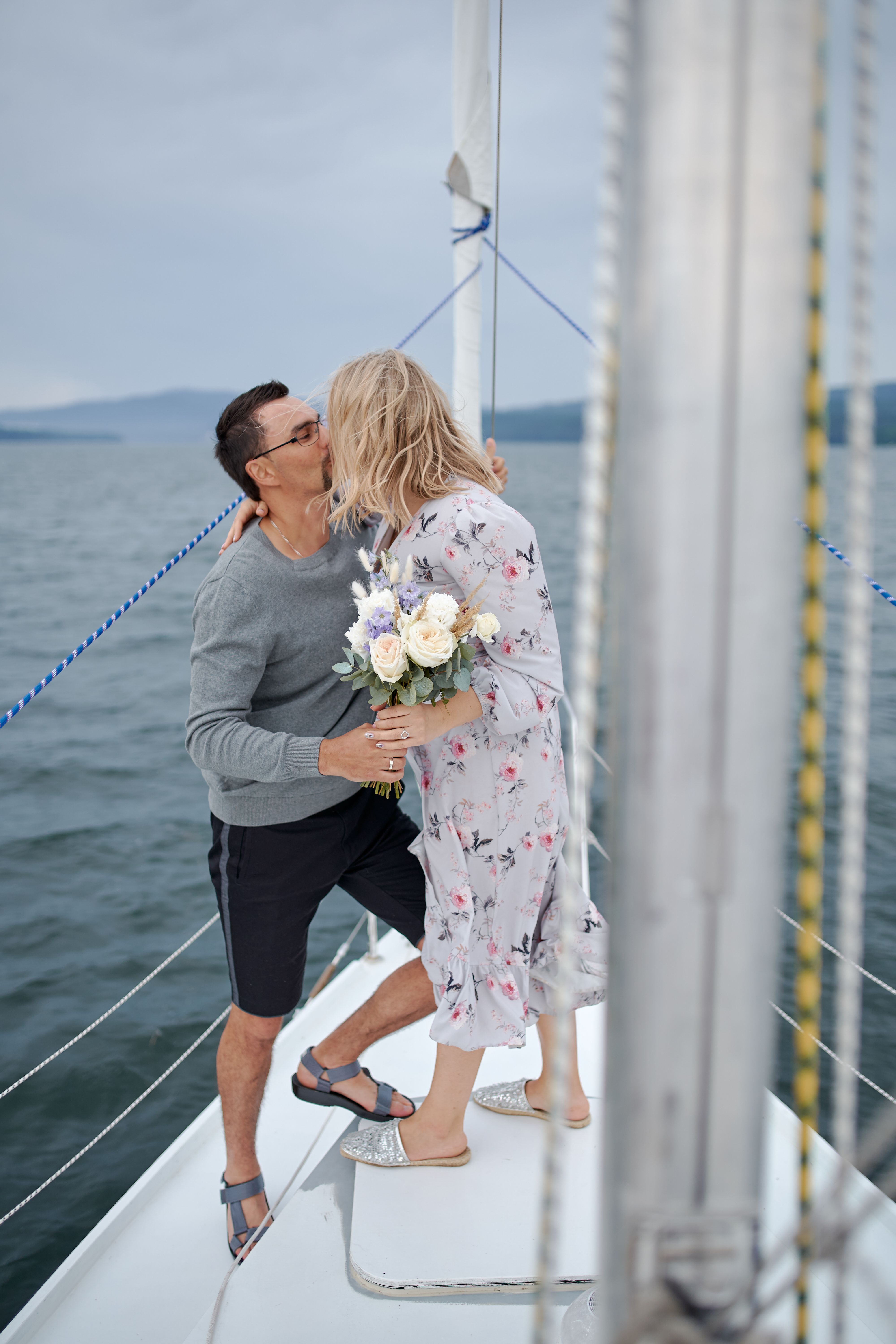 Couple celebrating aboard a motor yacht