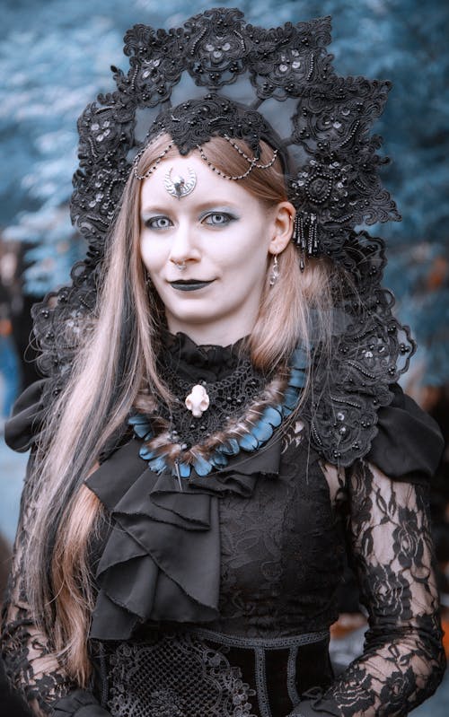 A Pretty Woman in a Black Costume Dress