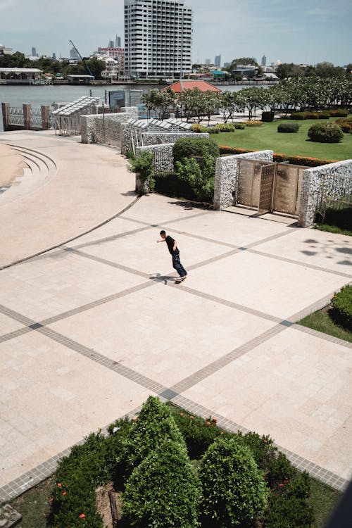 Man riding skateboard in modern city park