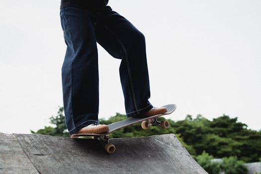 A skateboarder performs a trick on a ramp outdoors, capturing movement and skill.