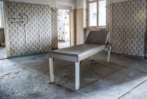 Free A Dirty Bed inside an Abandoned Building Stock Photo