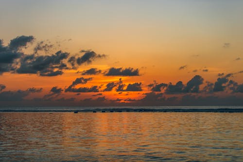 Majestic sunset sky over calm rippling sea