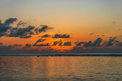 Free Scenic scenery of bright sunset sky over endless rippling sea in peaceful evening Stock Photo