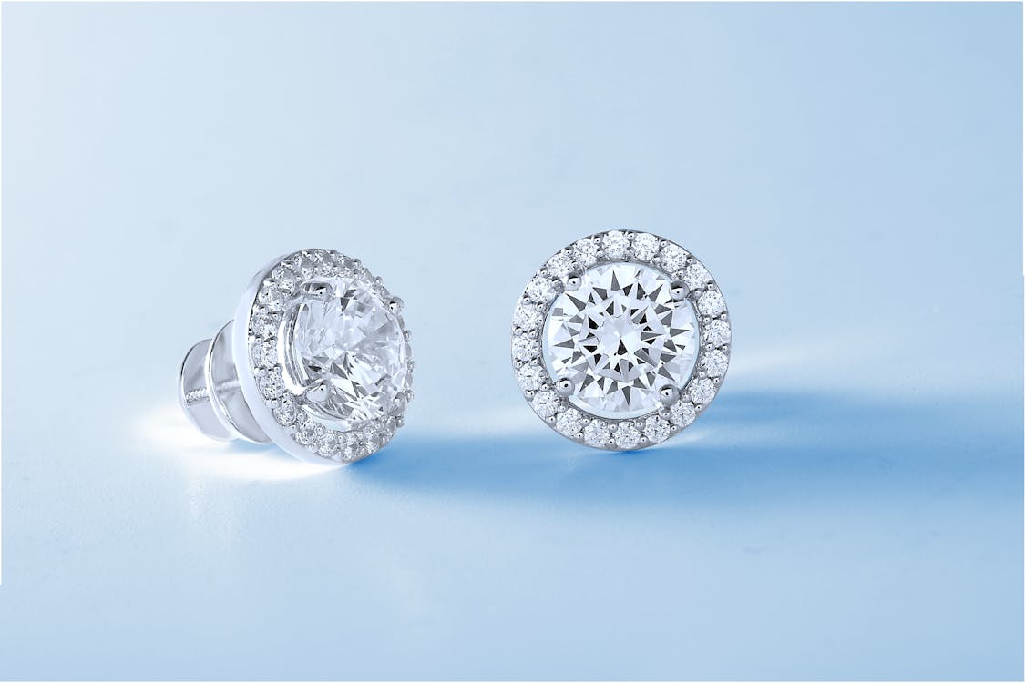 Silver Diamond Stud Earrings on White Background · Free Stock Photo