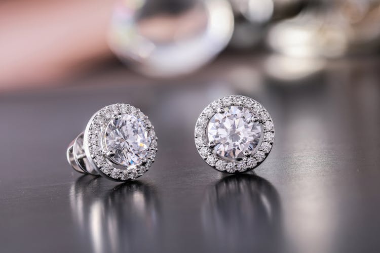 Silver Diamond Stud Earrings In Close Up Photography