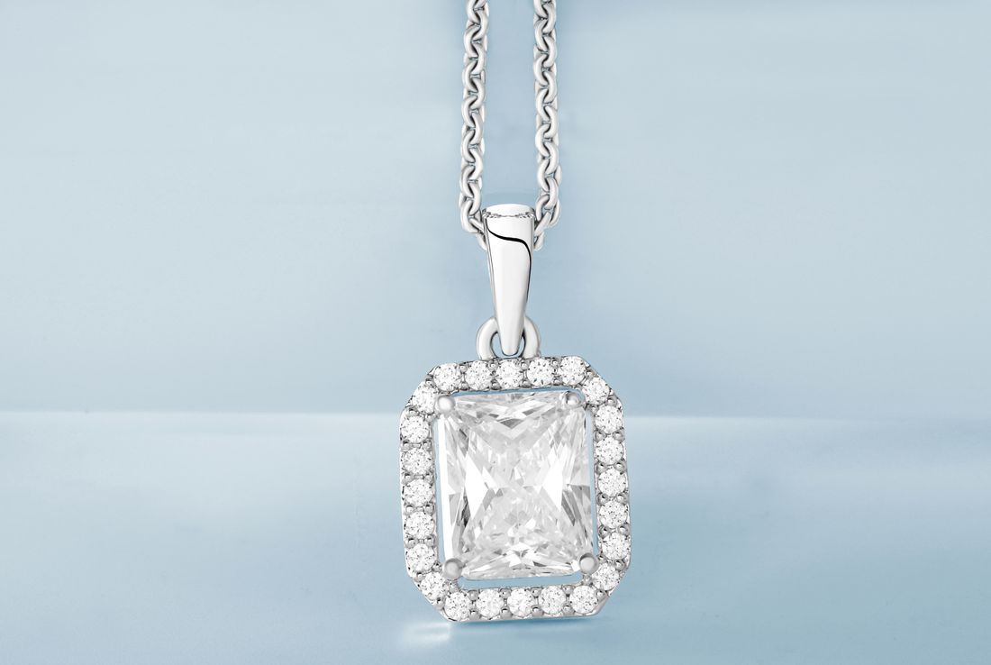 A diamond pendant photographed in soft light