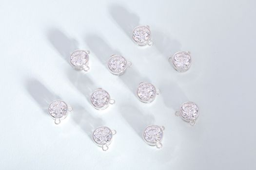 Luxurious diamond studs displayed in a minimalistic studio setup. Ideal for jewelry promotions.
