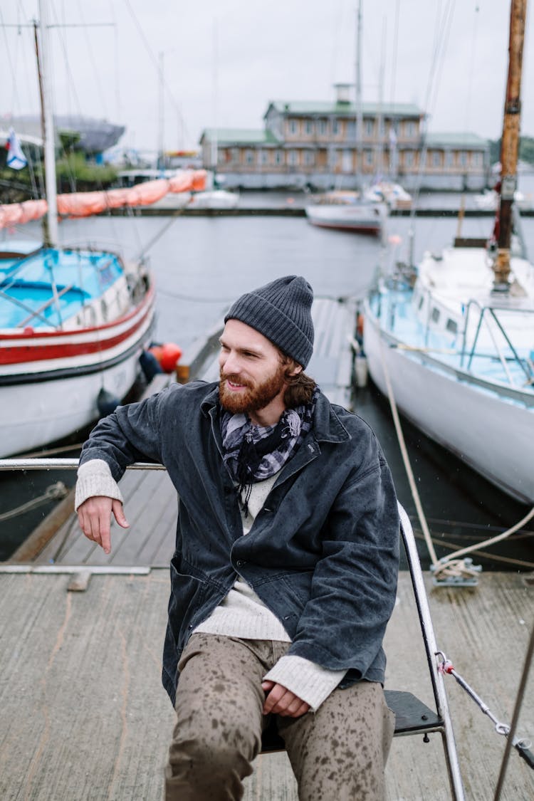 Man Sitting On The Dock
