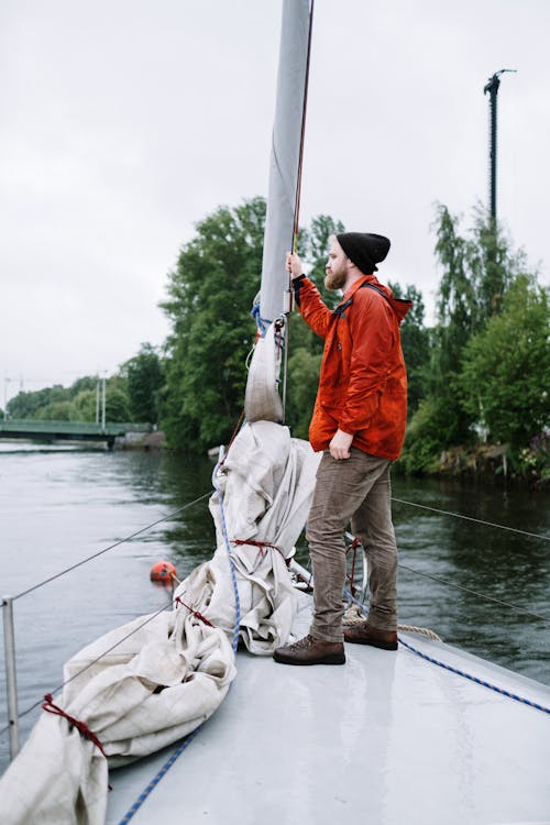 Free Man Standing on a Boat Stock Photo