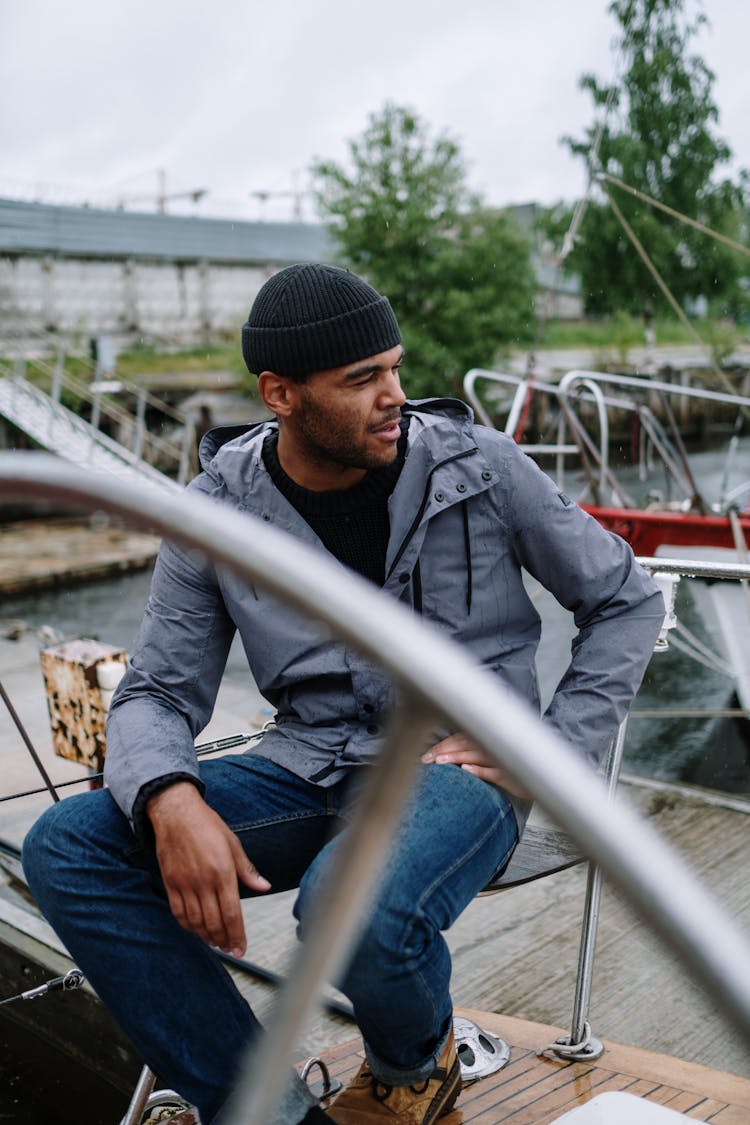 Man Sitting On The Dock