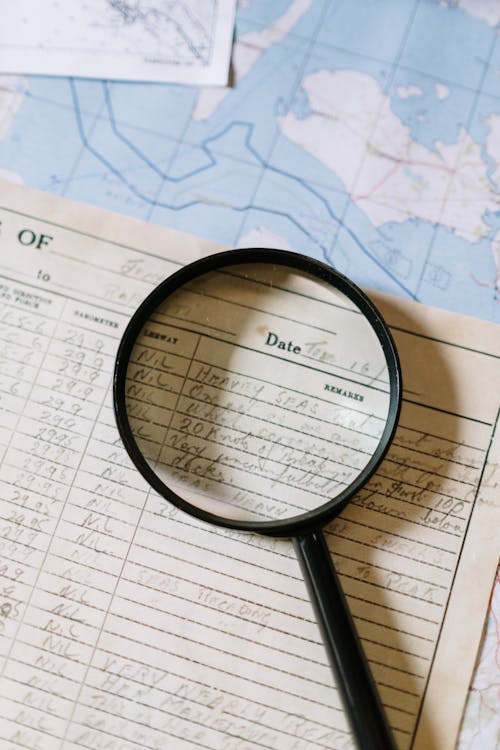 Magnifying Glass on Brown Paper 