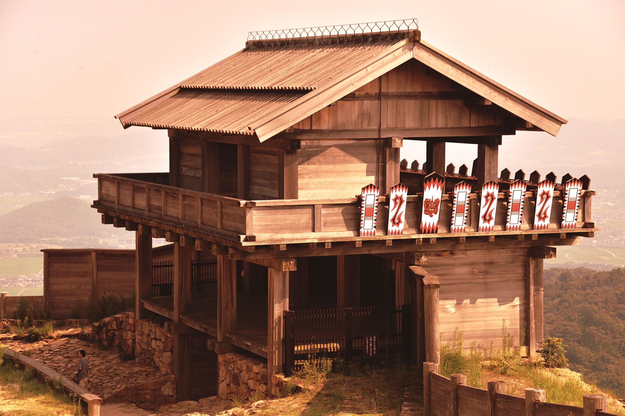 Explore the serene traditional Japanese wooden temple on a hill, capturing historic architecture and culture.