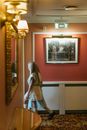 Woman in White Dress Standing in Front of Mirror