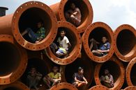 People Sitting on Brown Round Frame