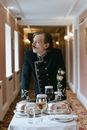 Man in Black Coat Holding White Ceramic Mug