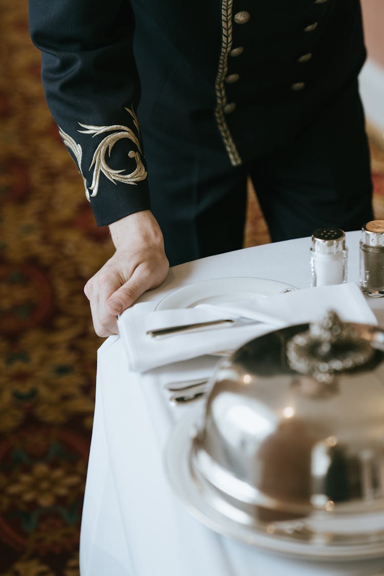 Bellboy Pulling A Serving Tray 