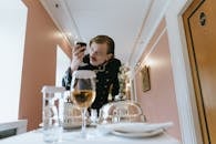 Guest Service Staff looking at a Wine Glass