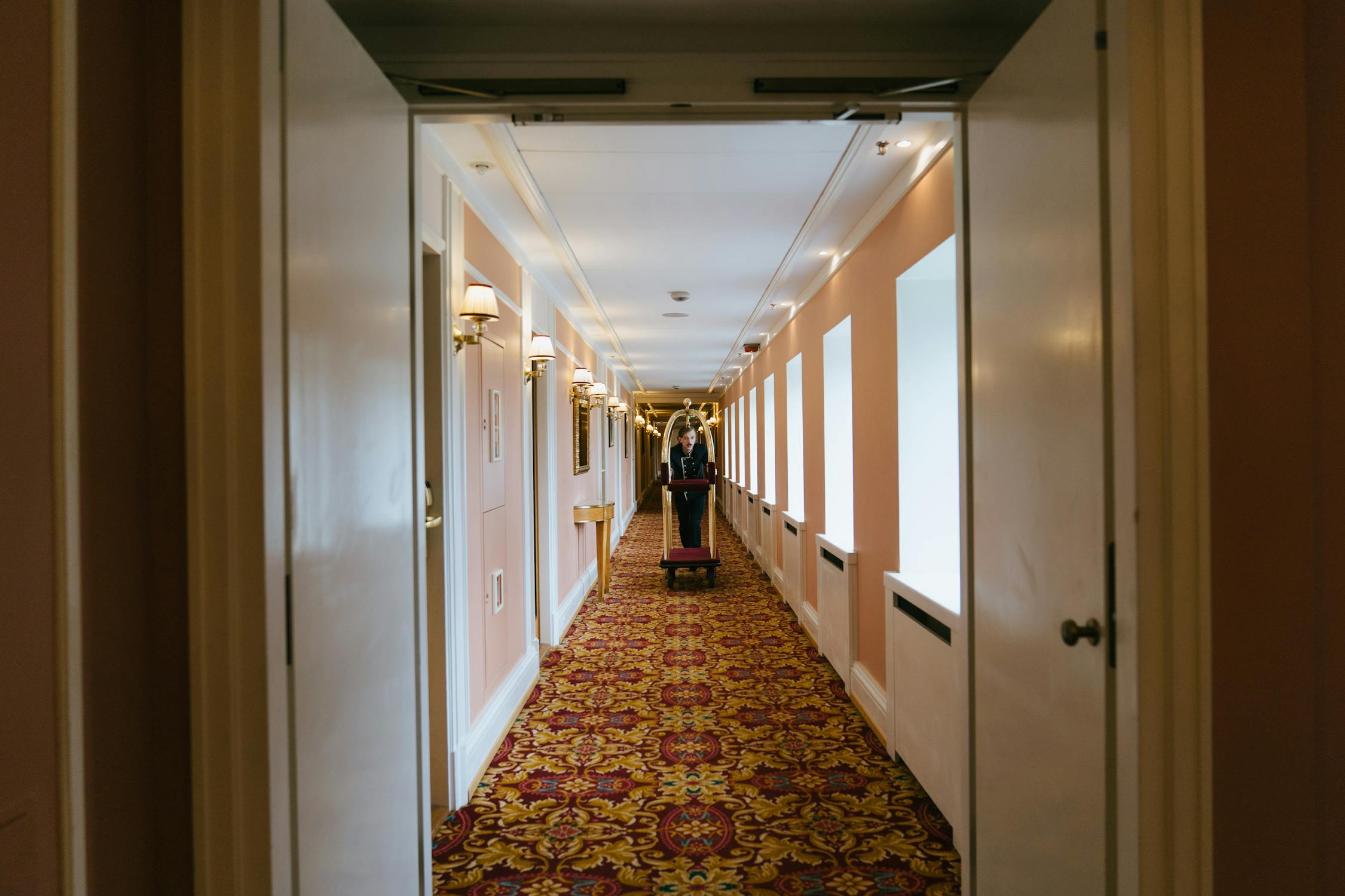 Happy hotel guests relaxing in lobby