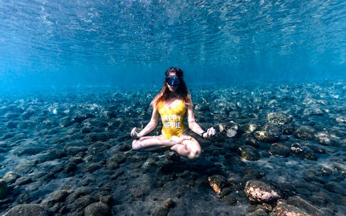 A Woman Meditating Underwater