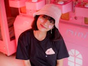 Smiling Asian young woman with stickers on face