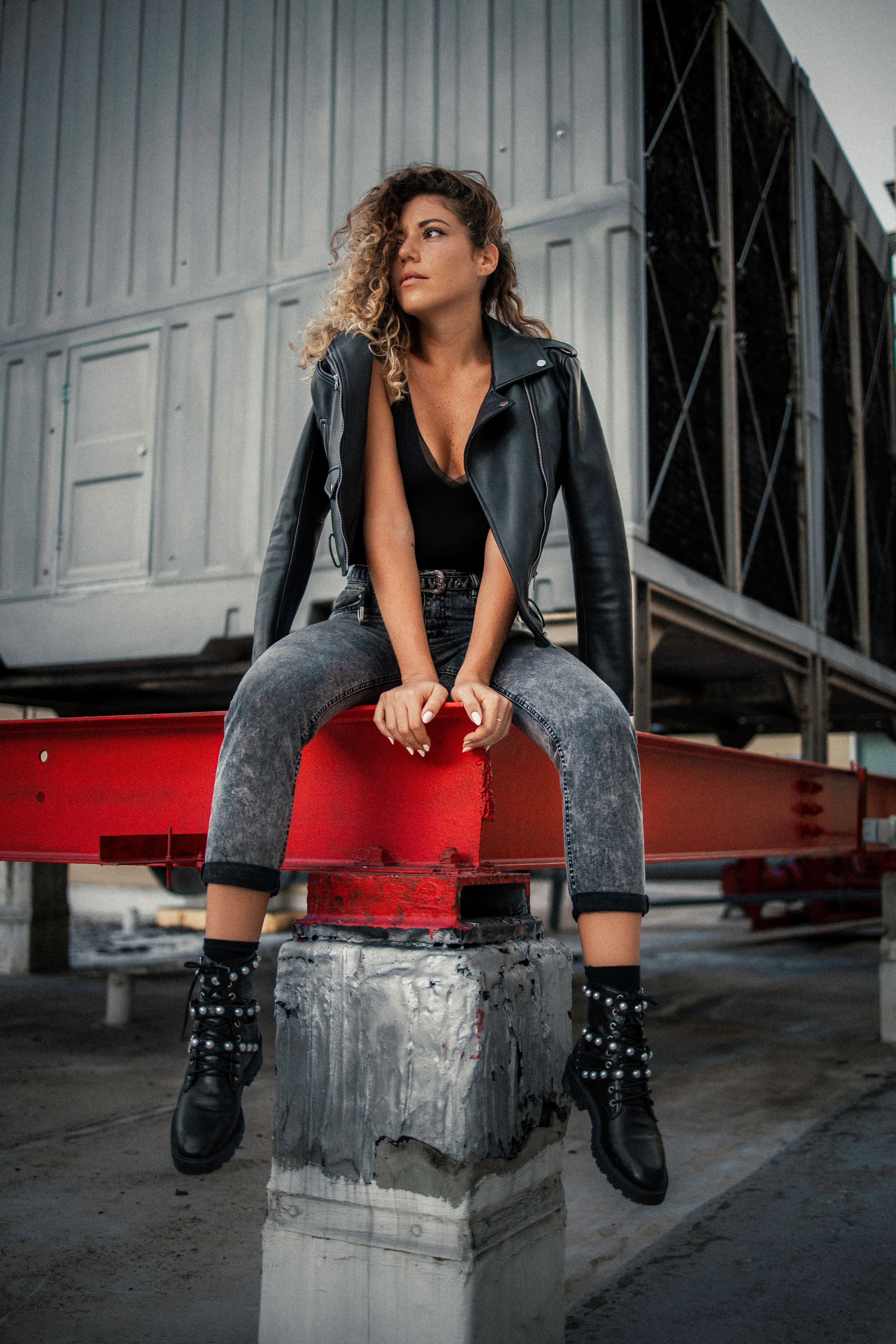 Woman in ripped jeans with leather jacket
